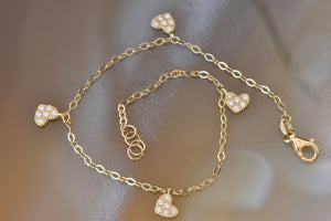 Gold bracelet with heart charm for ladies