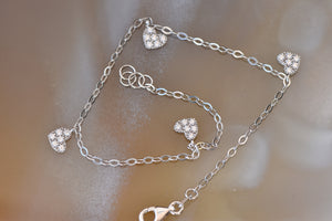 Gold bracelet with heart charm