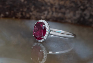 Halo oval pink tourmaline engagement ring