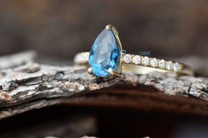 Unique engagement ring with Blue topaz