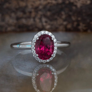 Halo oval pink tourmaline engagement ring