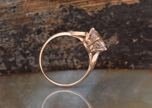 Alternative engagement ring with morganite ring and diamonds