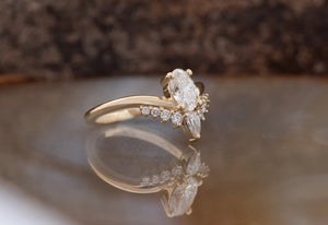 A Unique Oval 0.50 ct Diamond Ring with a Curve Band