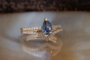 Tanzanite engagement ring with curve diamond matching band
