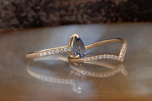 Tanzanite engagement ring with curve diamond matching band