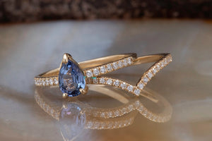 Tanzanite engagement ring with curve diamond matching band