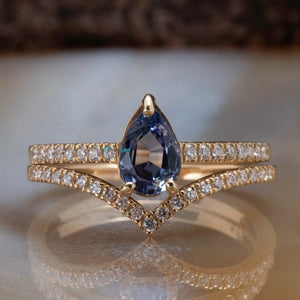 Tanzanite engagement ring with curve diamond matching band