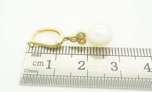 Pearl dangle earrings with diamonds