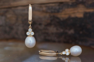 Pearl dangle earrings with diamonds